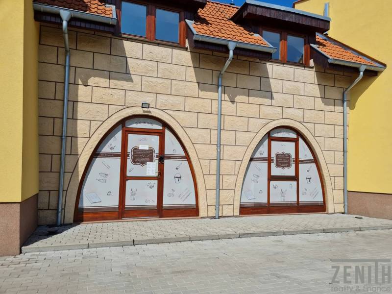 Commercial premises on Kukučínova Street in Dunajská Streda with stylized shop windows.