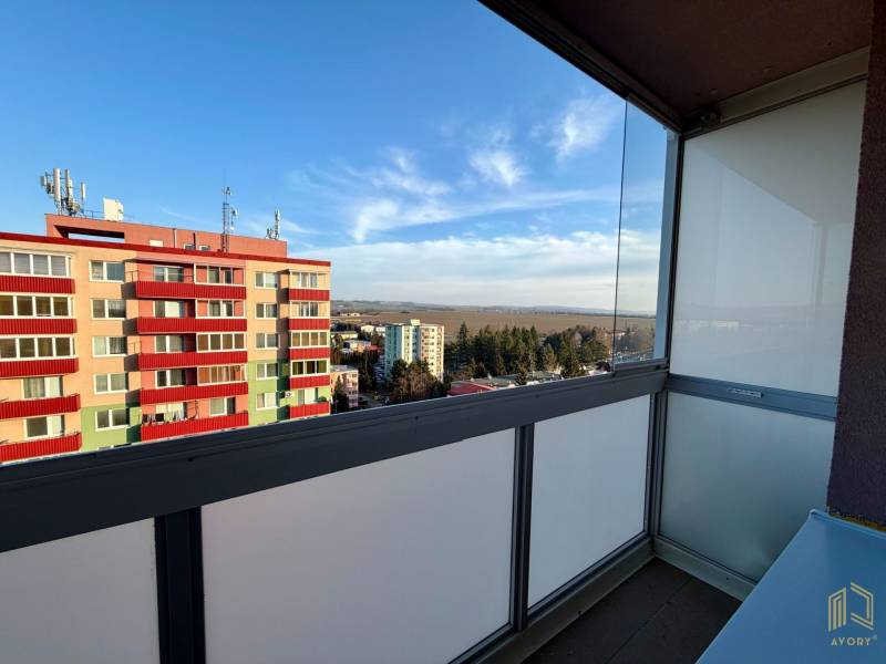 View from the balcony of a studio apartment on Štefánikova Street in Senica, overlooking the apartment buildings.