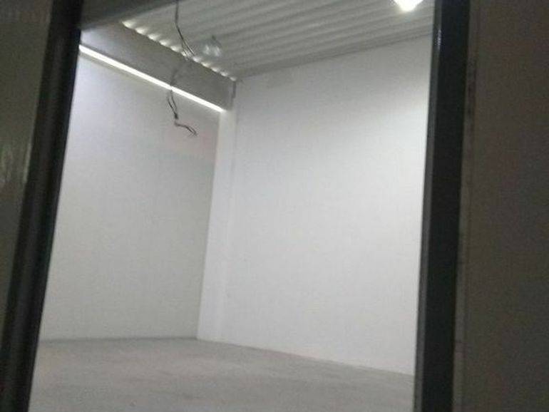 Empty room with white walls in the space of Warehouses and Halls.