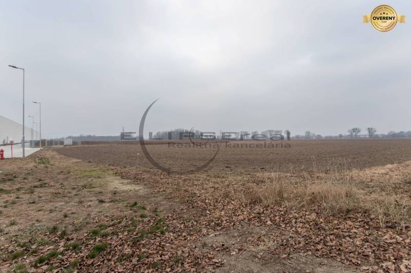 Commercial land on Priemyselná Street in Zohor, flat surface, close infrastructure.