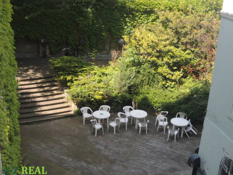 Terrace at the Offices on Konventná Street in Bratislava - Old Town with plastic seating.