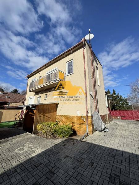 Family house in Tvrdošovce, Tvrdošovce Street, with a terrace and a paved courtyard.