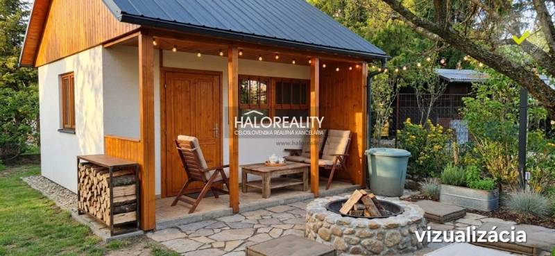 A garden in Galanta with a garden house, wooden cladding, and a seating area.