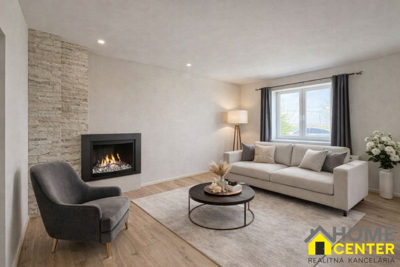 Interior of a family house with a fireplace, a comfortable armchair, and a floor with a wooden decor.