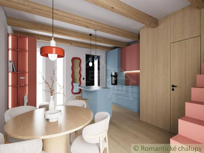 Interior of a cabin with an open kitchen, wooden ceiling beams, and a floor with a wooden decor.