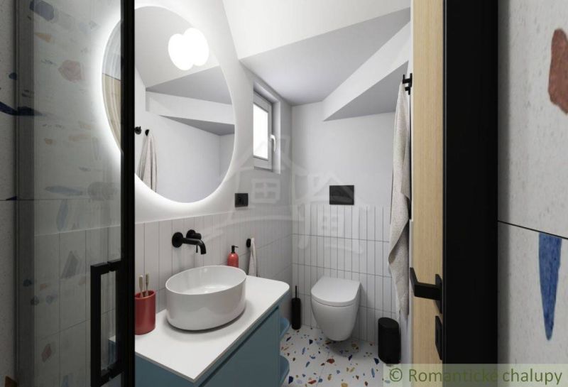 Bathroom in a cabin with a white sink and mirror, view of the toilet.