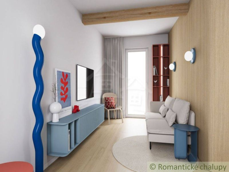 The interior of a cabin with a wood-patterned floor, a sofa, and unique blue decoration.