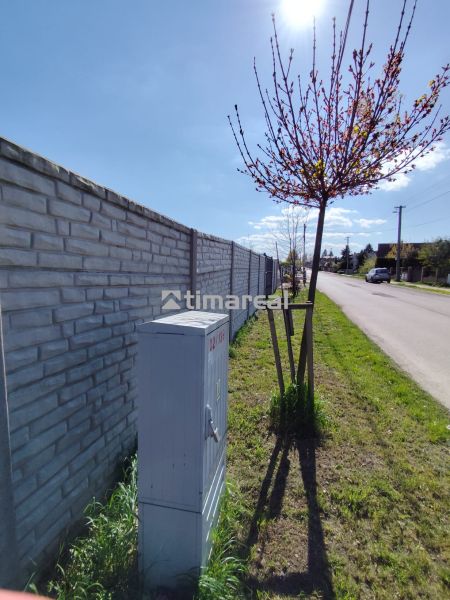 A brick fence along Rekreačná Street in Biely Kostol, plots - residential.