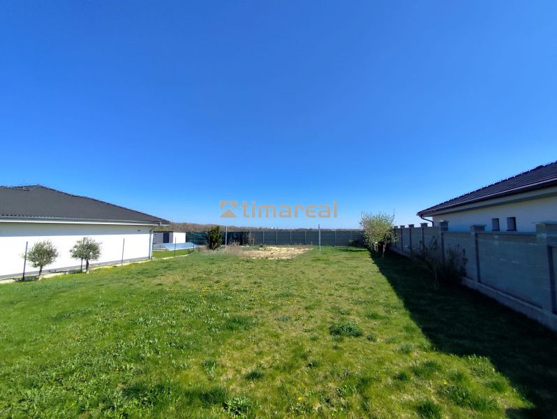 Land on Rekreačná Street in Biely Kostol with a landscaped green grassy area for living.