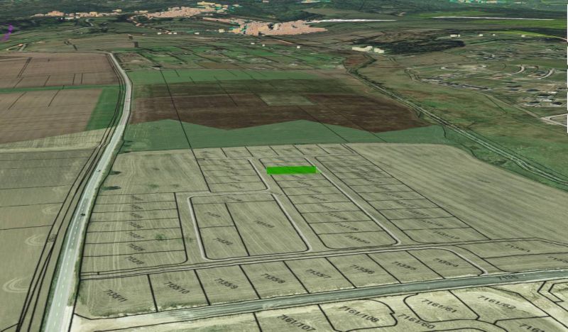 Aerial view of subdivided residential plots in the village of Mlynica.