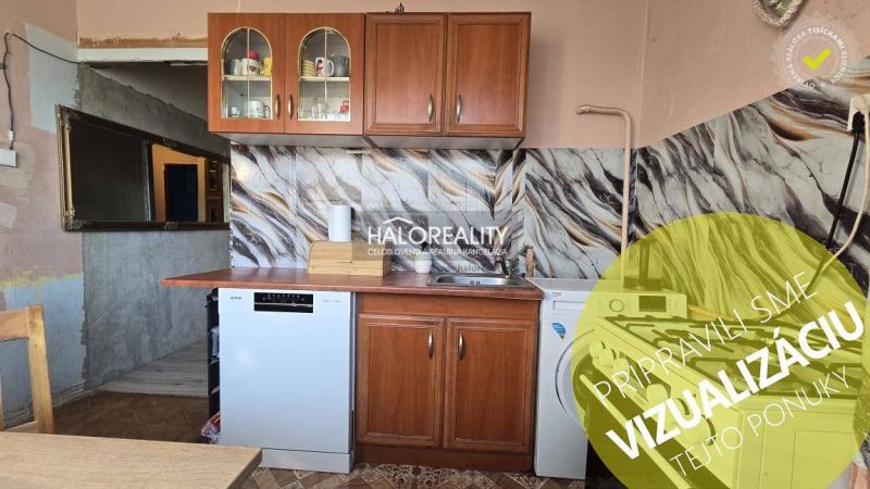 A kitchen unit with patterned tiles in a 3-room apartment.