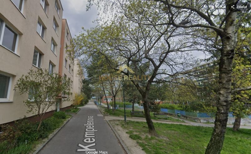 Kempelenova Street in Bratislava - Karlova Ves with a typical residential building and green trees.