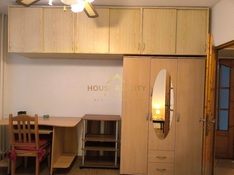The furniture in the 3-room apartment includes a desk, a wardrobe, and a chair.