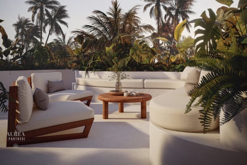 Tropical terrace in a villa in Bali with comfortable seating and exotic vegetation.