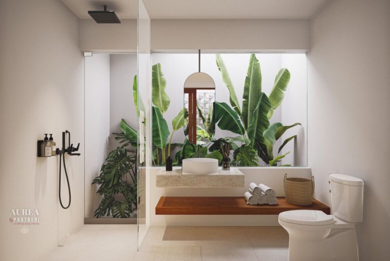 A bathroom in a villa with an open space, a modern shower, and large windows.