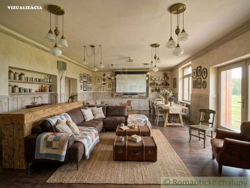 Living room with rustic furnishings, wood-patterned flooring, and a comfortable sofa.