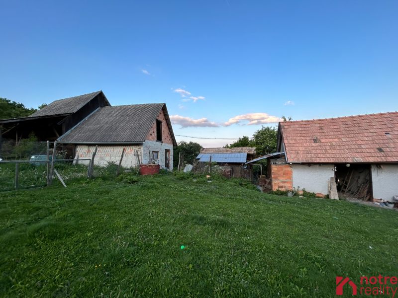 A family house in Kosihovce with a large garden and a rustic hayloft.