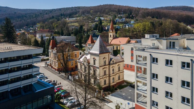 A view of historical architecture and modern buildings in Trenčianske Teplice.