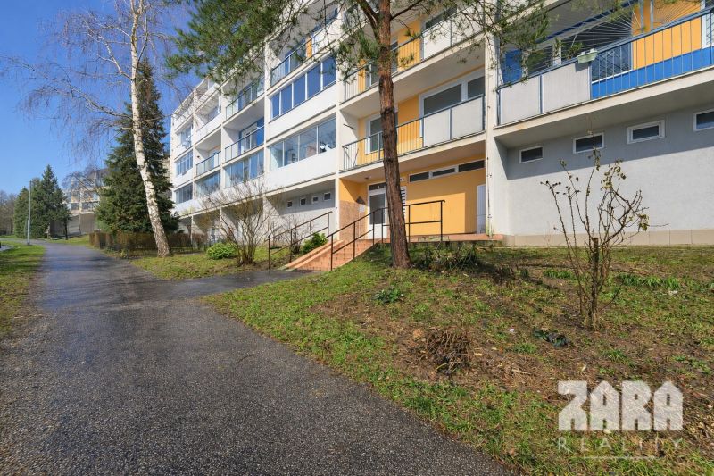 Apartment building on Adlerova Street in Košice, Dargovských hrdinov, surrounded by greenery.