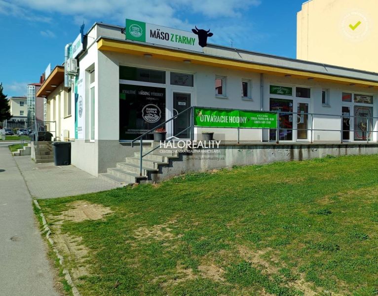 Commercial premises in Žiar nad Hronom with meat advertisement on a white exterior.