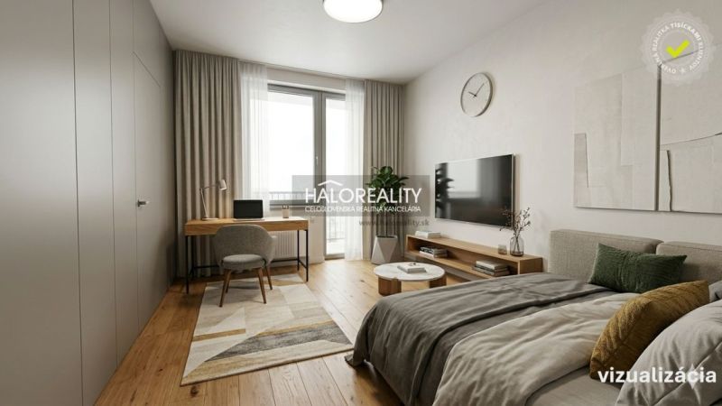 Bedroom in a 4-room apartment with wood-patterned flooring, a desk, and a television.