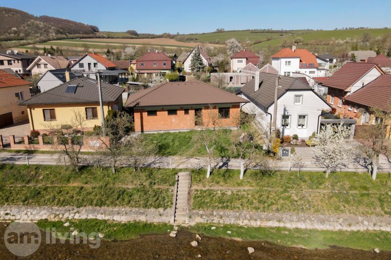 Family houses in the village of Drietoma surrounded by greenery and spring nature.