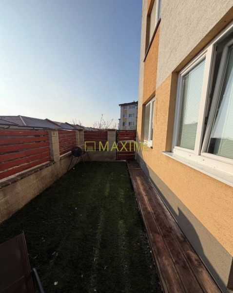 Yard with lawn and wooden terrace on M. R. Štefánika Street, Most pri Bratislave.