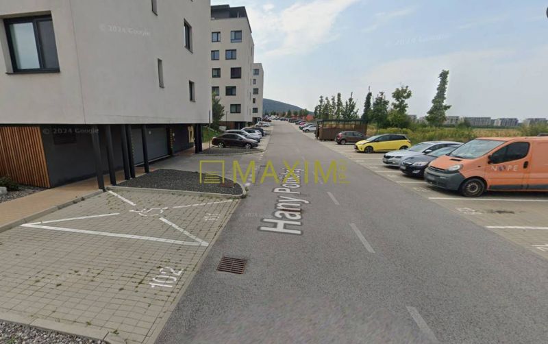 Garages on Hany Ponická Street in Bratislava - Lamač with parking spaces and cars.