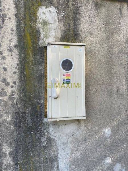 A cabinet on a worn-out wall on Astronomická Street in Bratislava - Ružinov.