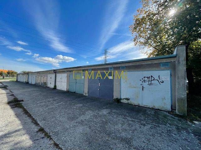 A row of garages on Astronomická Street in Bratislava, Ružinov under the blue sky.