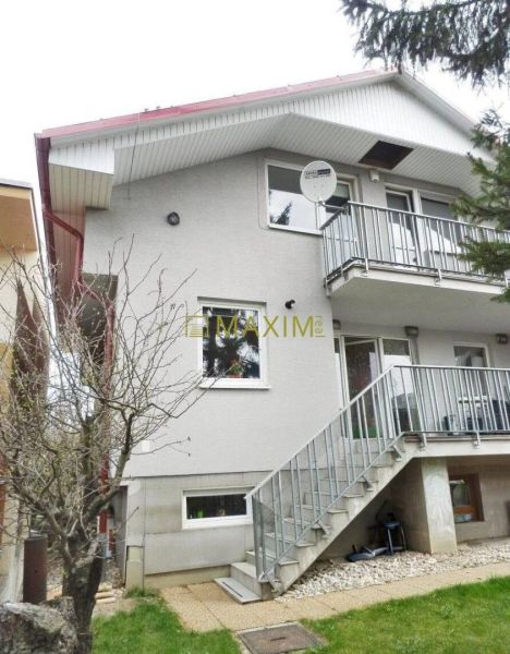Cottage on Mokráň Záhon in Bratislava - Ružinov, with an external staircase and a satellite dish.