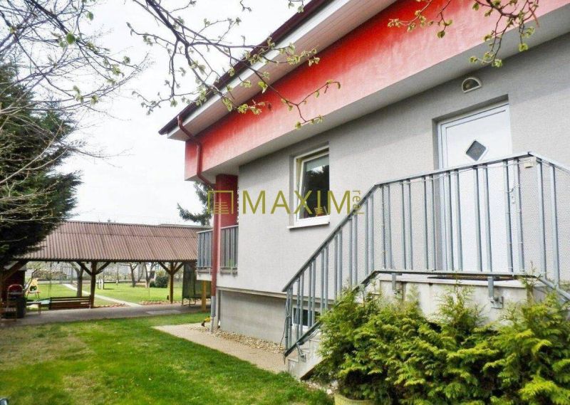 A cottage in Bratislava - Ružinov on Mokráň Záhon with a terrace and stairs.