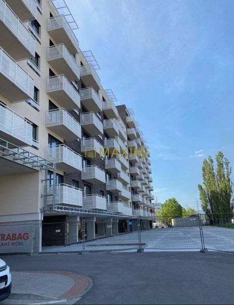 A building with balconies on Galvaniho Street in Bratislava - Ružinov, suitable for a 2-room apartment.