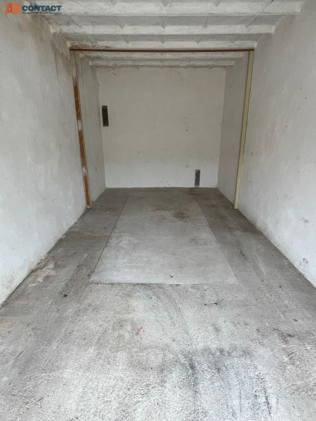 Garages on Dopravná in Piešťany with concrete floors and light-colored walls.