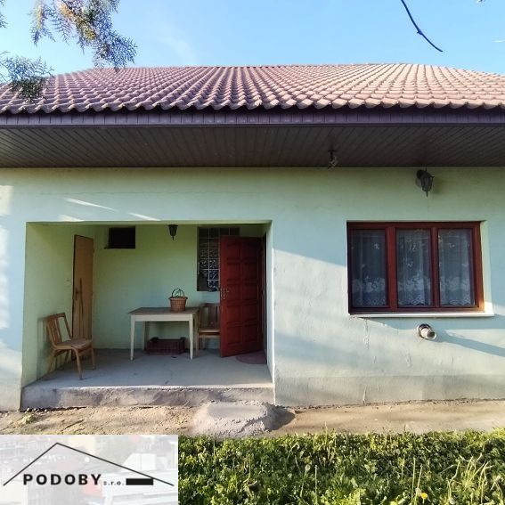 A family house in Veľké Úľany with an open terrace and a red roof.