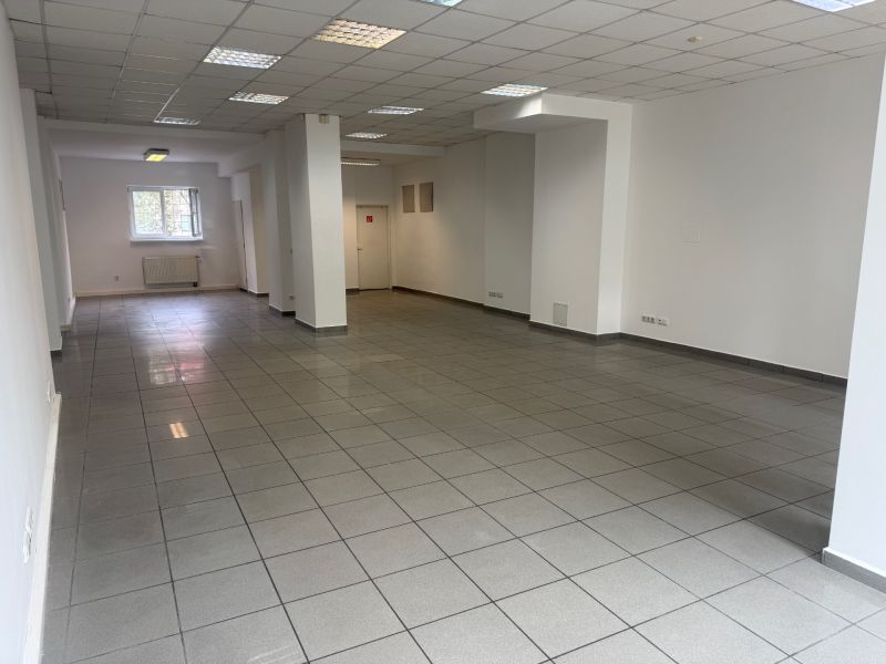 Spacious commercial premises with tiles and white walls.