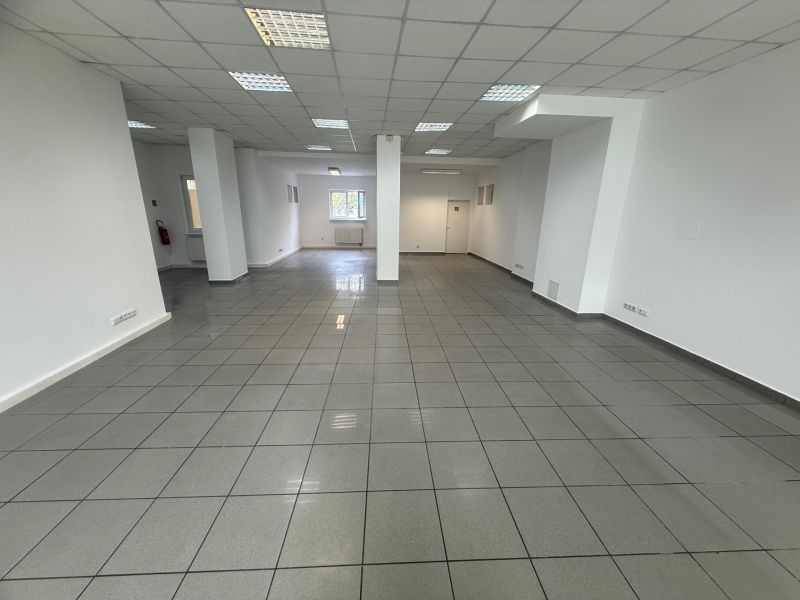 Interior of commercial spaces with white walls and tiles.