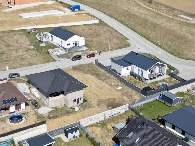 Aerial view of plots - housing in Malý Slavkov with houses under construction.