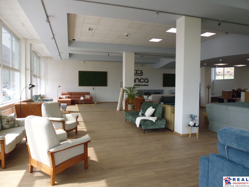 Commercial spaces with comfortable seating and wooden decor flooring.