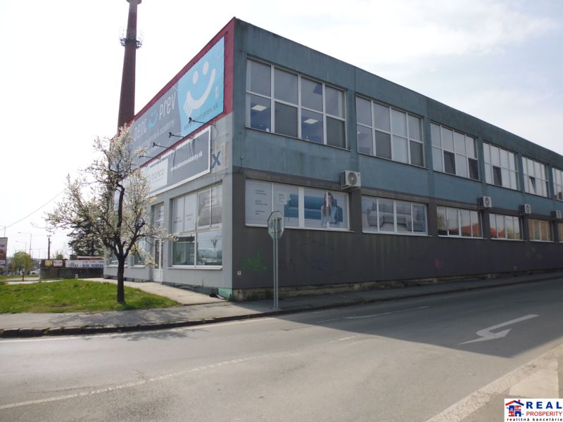 Commercial premises at Masarykova 22 in Prešov, a two-story building by the road.