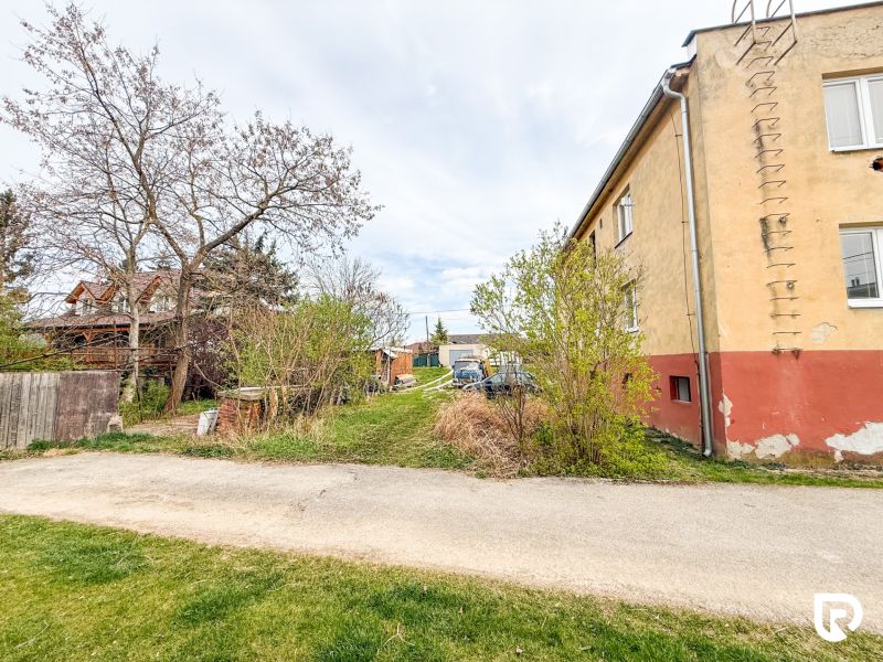 Hrabovská Street in Trenčín, the road runs alongside an older house with a garden.
