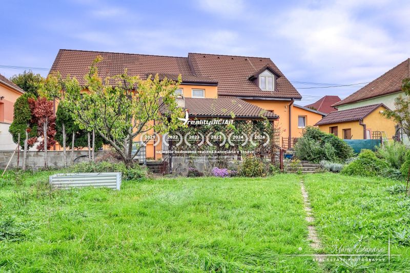 A family house in Špačince with a spacious garden, lawn, and terrace on Špačince street.