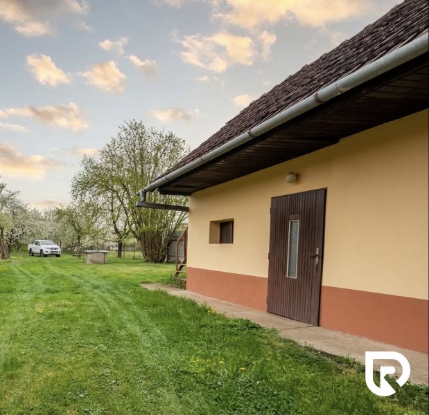 Exterior of a house with a lawn on Biskupická Street in Trenčín, Land - housing.