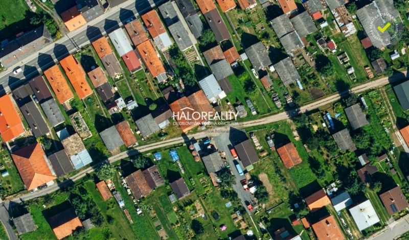 Aerial view of terraced family houses with yards in Hybe.