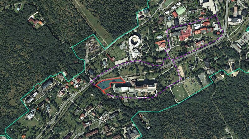 Aerial view of hotels and guesthouses in the High Tatras surrounded by forests and roads.