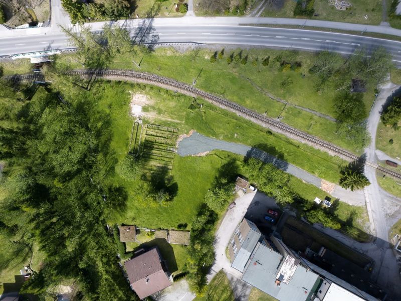 Aerial view of the railway track and surroundings near hotels and guesthouses in the High Tatras.