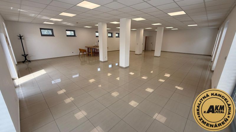Spacious commercial spaces with white walls, tiles, and columns ideal for various uses.