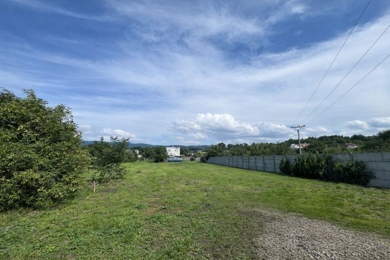 Plots - housing on Ábovská Street in Ždaňa, green area with power lines.
