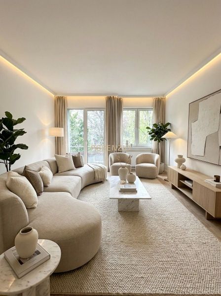 A bright living room with a comfortable sofa set and decorative furniture in a 4-room apartment.