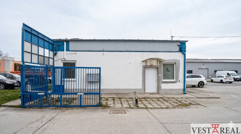 The blue gate leads to the industrial area on Bulharská Street in Trnava.